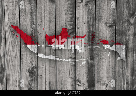 Map and flag of Indonesia on weathered wood Stock Photo