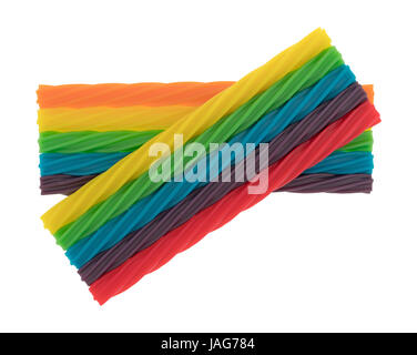 Several colorful spiral licorice sticks isolated on a white background. Stock Photo