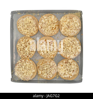 Top view of mini cheese bagels in a microwavable tray isolated on a white background. Stock Photo
