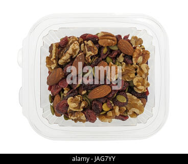 Top view of omega 3 trail mix nuts and fruit in a plastic container isolated on a white background. Stock Photo