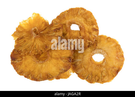 Top view of a close group of sun dried pineapple slices isolated on a white background. Stock Photo