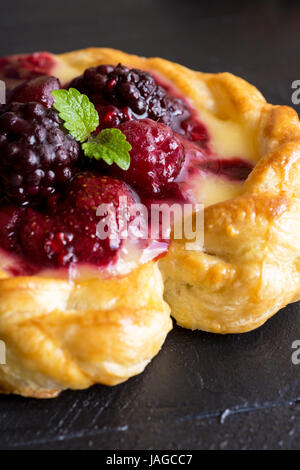 Vanilla Cream and Fruit Berry Puff Pastry Dessert on Dark Background Stock Photo