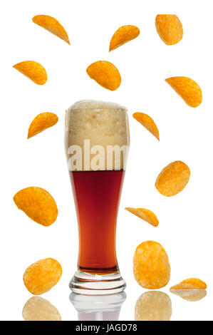 dark beer in glass with chips on white background Stock Photo