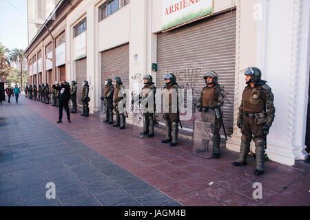 Valparaiso, Chile - June 01, 2017: Chilean riot police occupy the streets of Valparaiso, following President Michelle Bachelet’s annual state-of-the-u Stock Photo