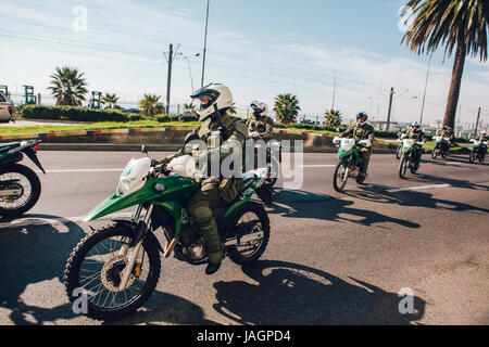 Valparaiso, Chile - June 01, 2017: Police on motorcycle repressing protesters during a protest in Valparaiso Stock Photo
