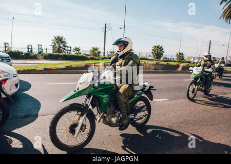 Valparaiso, Chile - June 01, 2017: Police on motorcycle repressing protesters during a protest in Valparaiso Stock Photo