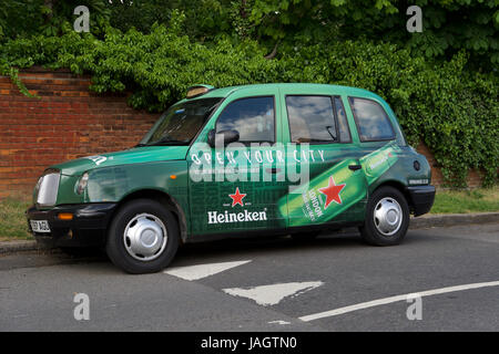 Green London taxi cab advertising says: 'Green is the new black' Stock ...