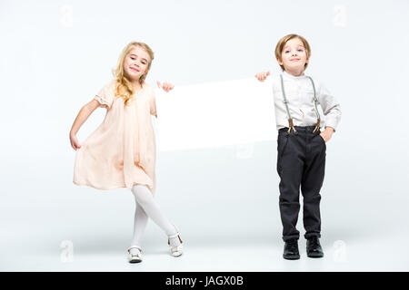 Kids holding blank card Stock Photo