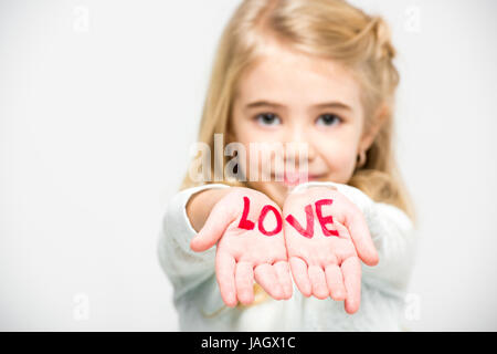 Word love written on palms Stock Photo