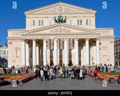 MOSCOW, RUSSIA - OCTOBER 13: tourists in front of Bolshoi Theatre in Moscow, Russia on October 13, 2013. The square was designed in neoclassical style by Joseph Bove 1820s years Stock Photo