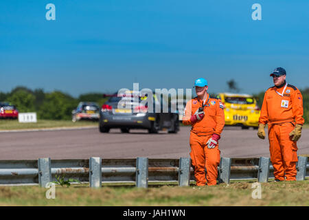 A Motorsport Marshal stationed at his post during the 2017 BTCC meeting at Thruxton. Stock Photo