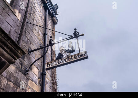 Sign outside the People's Story Museum, a museum housed in the historic Canongate Tolbooth, which tell the story of the people of Edinburgh, Scotland Stock Photo