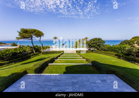 Sea view from green garden of Mediterranean resort, Greece Stock Photo