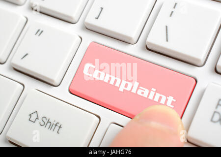 Pressing red complaint key on keyboard Stock Photo