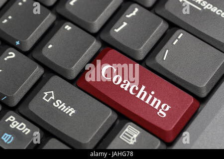 Red coaching key on keyboard Stock Photo