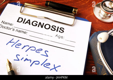 Herpes simplex written in a document on a table. Stock Photo