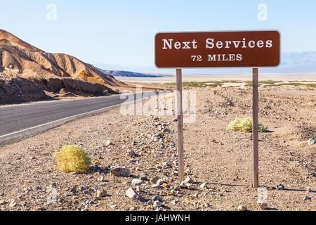 Death Valley, USA. Next service streetsight useful for travel concept Stock Photo