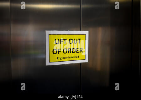 A lift with a sign on saying that the lift is Out of Order Stock Photo ...