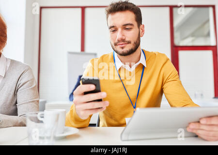 Business man using SMS smartphone app for writing message Stock Photo