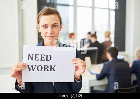 Young woman candidate looking for a job and unemployed holding sign Stock Photo