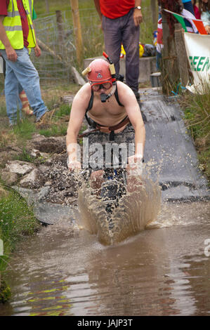 Mountain Bike Bog Snorkelling Championships, Llanwrtyd Wells, Wales, UK, where competitors try to cycle through a Welsh bog course. Stock Photo