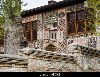 Summer palace of Sheki Khans, Şəki xanlarının sarayı, In the town Shaki/Sheki in Azerbaijan, façade with ornamental tiles and wooden framed windows Stock Photo