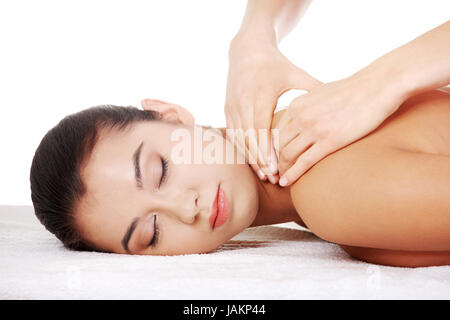 Preaty young woman relaxing beeing massaged in spa saloon Stock Photo