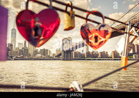 Hearth shape padlocks, Brooklyn Bridge and Manhattan on the background, New York City Stock Photo