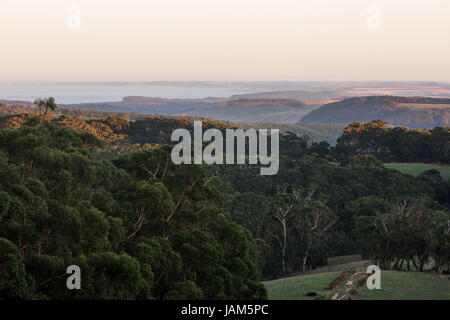 Sunset looking out at the twelve apostles from a distance in Australia Stock Photo