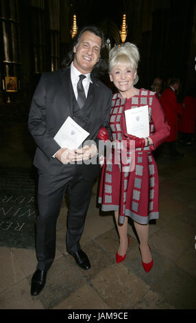 Dame Barbara Windsor and husband Scott Burnet in Westminster Abbey, London after the Service of Thanksgiving for the Life and Work of the Ronnie Corbett who died last year. Stock Photo