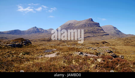 The outline of the three peaked mountain Quinag, left to right, Spidean Coinich, Sail Gharbh, and Sail Gorm, seen from the east over high moorland. Stock Photo