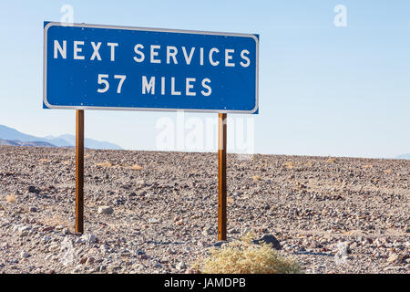 Death Valley, USA. Next service streetsight useful for travel concept Stock Photo