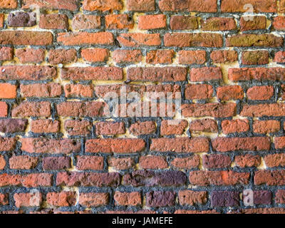close-up of old brick wall with multiple layers of pointing repairs Stock Photo