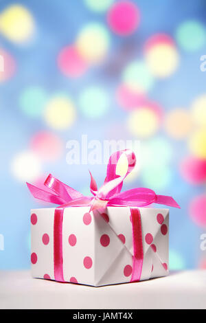 Gift package,white-pink,background lights,Christmas,Valentinstag,birthday,Mother's Day,jubilee,Valentinsgeschenke,birthday presents,Mother's Day presents,Christmas presents,small,sweetly,presents,presents,packs,affectionately,loop,spot,dots,spotted,scored,brightly,huge number,many,icon,give,distribution of presents,shine,pastel,surprise,prejoy,colour tuning,colour,pink,pink,white,studio, Stock Photo