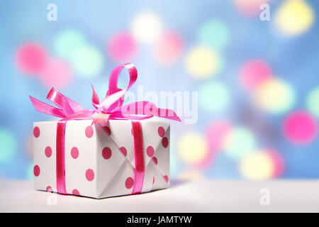 Gift package,white-pink,background lights,Christmas,Valentinstag,birthday,Mother's Day,jubilee,Valentinsgeschenke,birthday presents,Mother's Day presents,Christmas presents,small,sweetly,presents,presents,packs,affectionately,loop,spot,dots,spotted,scored,brightly,huge number,many,icon,give,distribution of presents,shine,pastel,surprise,prejoy,colour tuning,colour,pink,pink,white,studio, Stock Photo