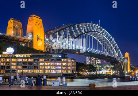 Sydney Harbour Bridge with Hyatt Park Hotel at dusk. Sydney, NSW, Australa. Stock Photo