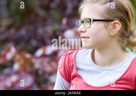 Young girl in park in spring day - portrait Stock Photo