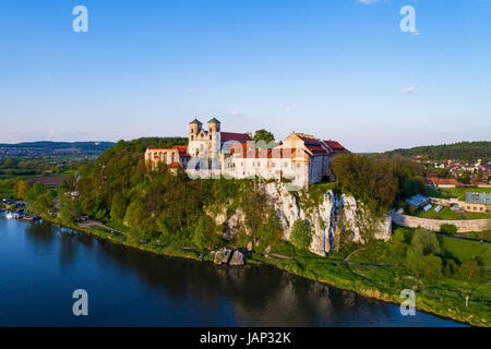 Benedictine monastery on the rocky hill in Tyniec near Cracow, Poland and Vistula River. Aerial view at sunset Stock Photo