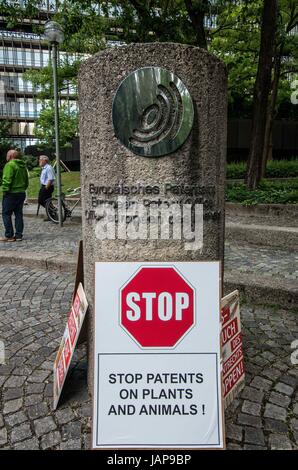 Munich. 7th June, 2017. Approximately 40 protestors assembled at the European Patent Office in Munich, Germany, in order to protest against further patenting of grains used in beer production. In 2016, Carlsberg and Heineken had both secured such patents. The demonstration was organized by the 'Buendnisse Keine Patente auf Saatgut'', who alleges that those who obtain patents on living materials would not only have control of genetically-modified stocks, but also over naturally-produced and selected materials. They furthermore allege misuse of the patent system.Several representatives wen Stock Photo