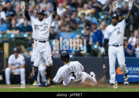 Milwaukee, WI, USA. 6th June, 2017. Milwaukee Brewers shortstop Orlando Arcia #3 slides safely into home plate during the Major League Baseball game between the Milwaukee Brewers and the San Francisco Giants at Miller Park in Milwaukee, WI. John Fisher/CSM/Alamy Live News Stock Photo