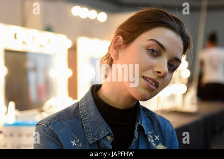 London, UK. 7 June 2017. A model prepares backstage ahead of The Gala Award Show taking place on the final day of Graduate Fashion Week at the Old Truman Brewery in East London.  The event showcases the graduation show of up and coming fashion designers from UK and international universities. Credit: Stephen Chung / Alamy Live News Stock Photo