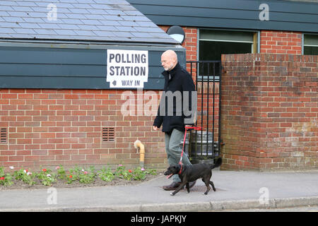 Didcot, UK. 8th June 2017. Man walking to a polling station with his dog to cast his vote in the UK General Election. Credit: CoCo Jones/Alamy Live News.