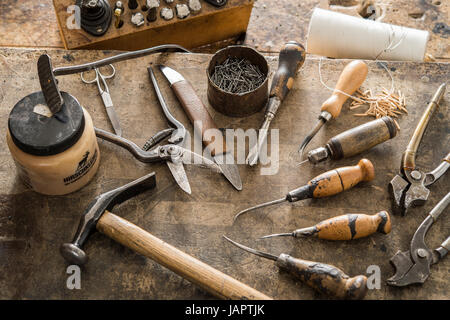 Shoemaker, various tools on work table, Kainisch, Styria, Austria Stock Photo