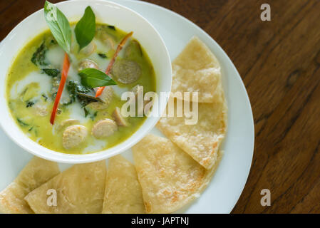 Thai green curry german sausage with roti, Thai fusion dishes. Stock Photo