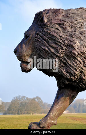 Longleat House, Wiltshire, UK. 17th March, 2016. A magnificent sculpture of a lion by African based sculptor Bruce Little. Stock Photo