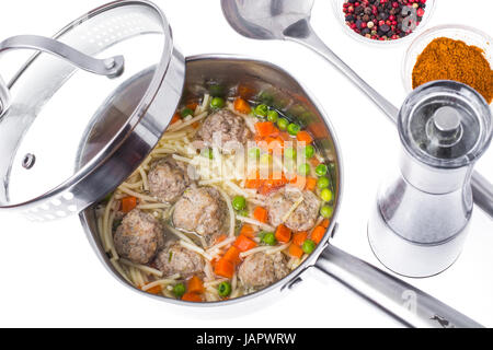 Soup with meatballs on white background Stock Photo