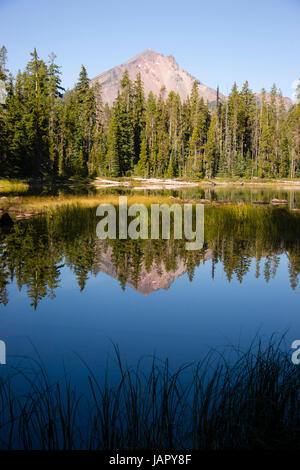 Four Mile Lake shows a nearly perfect reflection for Mt McLoughlin Stock Photo