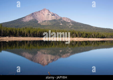 Four Mile Lake shows a nearly perfect reflection for Mt McLoughlin Stock Photo