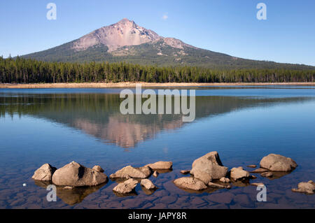 Four Mile Lake shows a nearly perfect reflection for Mt McLoughlin Stock Photo