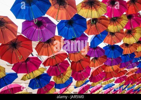 Umbrellas suspended in the air above shoppers in Southgate Shopping Centre, Bath, UK 2 Stock Photo